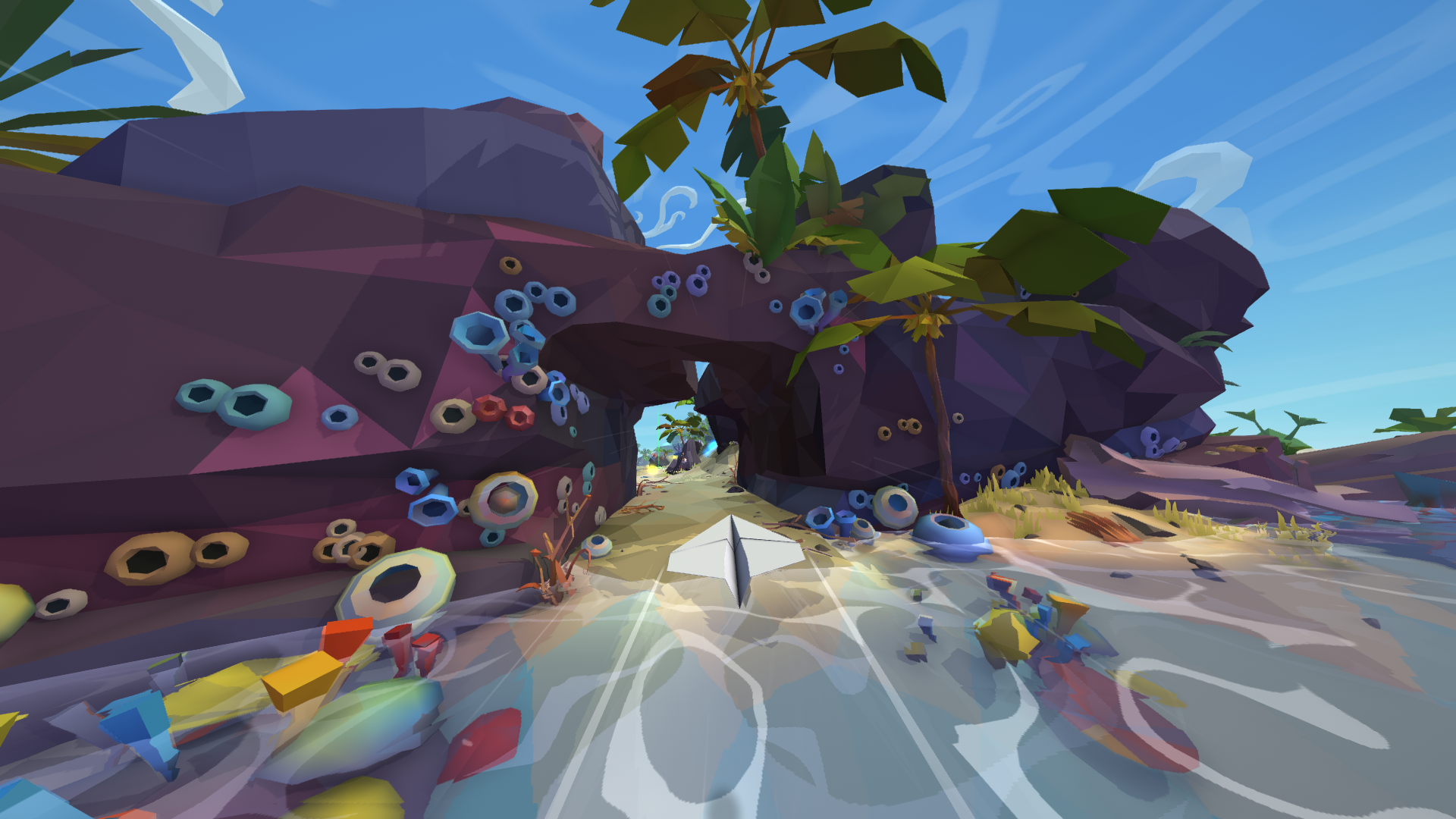 Screenshot of a paper airplane flying over a coastal landscape from the video game Lifeslide.