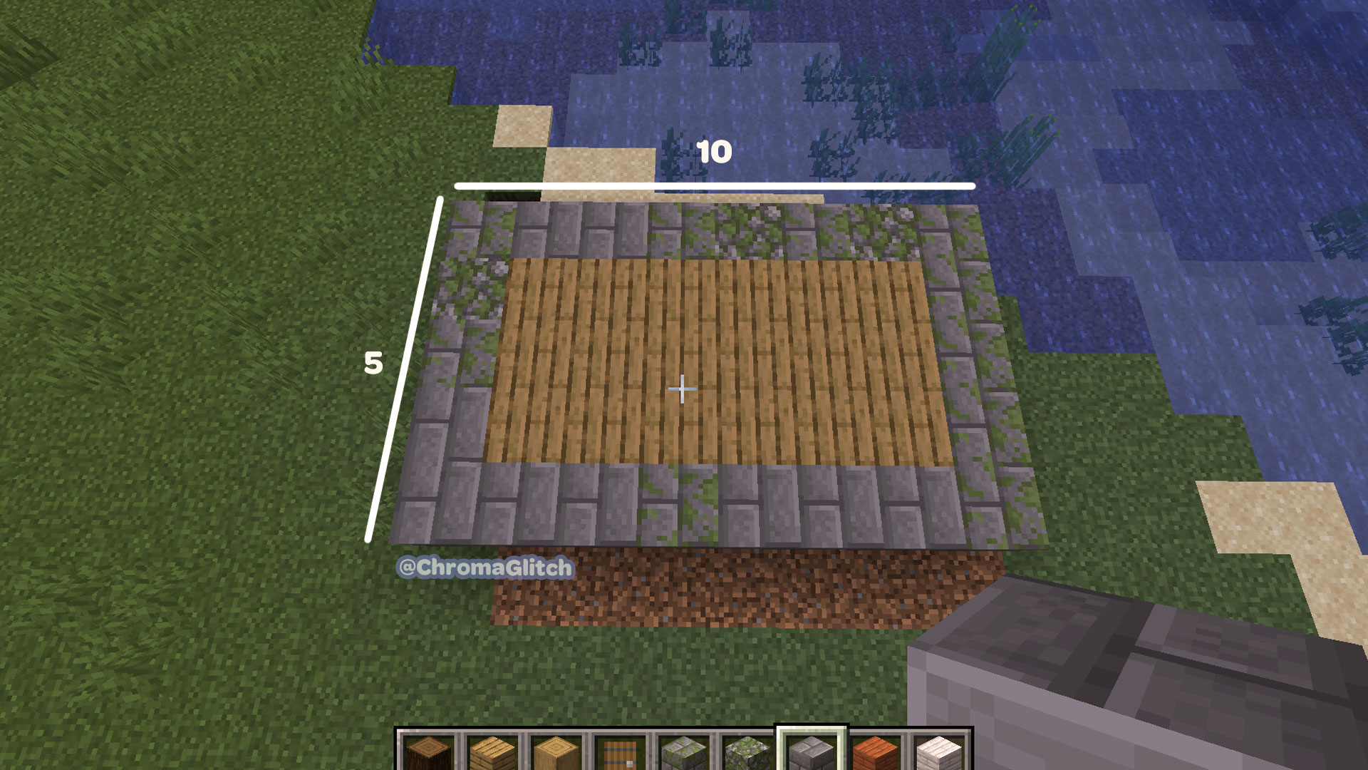 A screenshot of a rectangle house base in Minecraft. The base is a 5x10 rectangle with cobblestone around the sides and wood blocks in the middle.