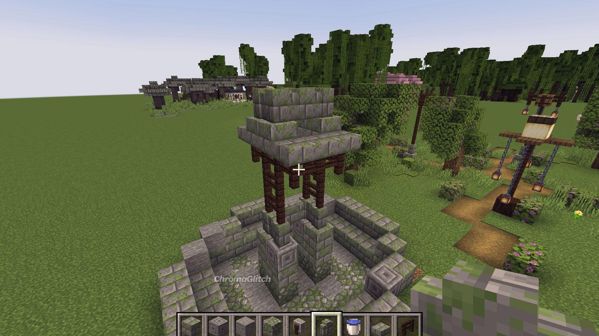 Stone slabs have been stacked on top of the center tower on the fountain built in Minecraft.